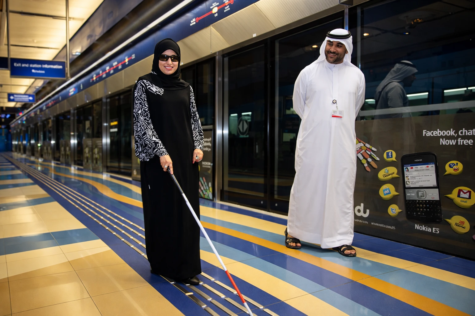 Tactile and directional wayfinding signage mounted on a facility wall as part of an accessible wayfinding UAE installation