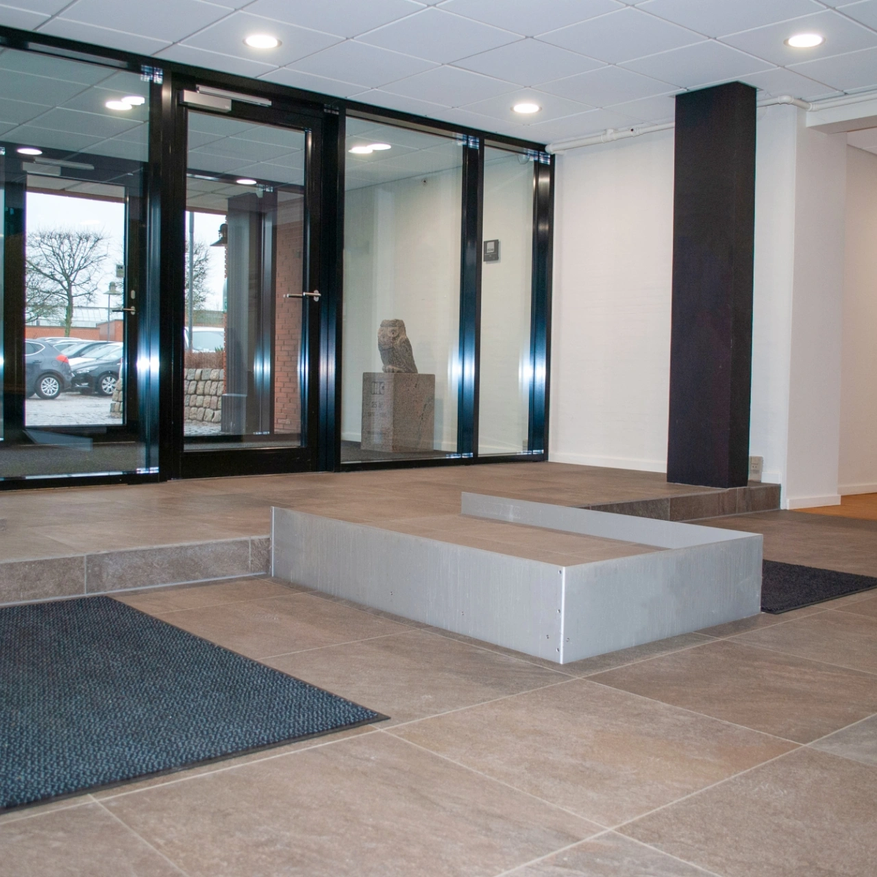 HDN platform finished with the same granite tile as the surrounding lobby floor