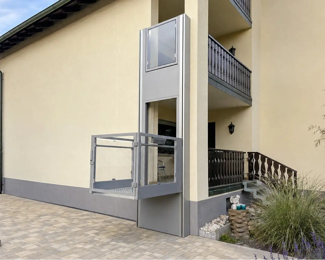 Sigma enclosed cabin platform lift installed at a UAE villa entrance