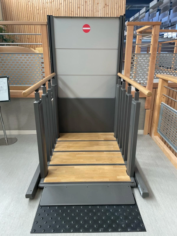 Flex Step platform showing the fold-down access ramp and crush guard beneath the steps